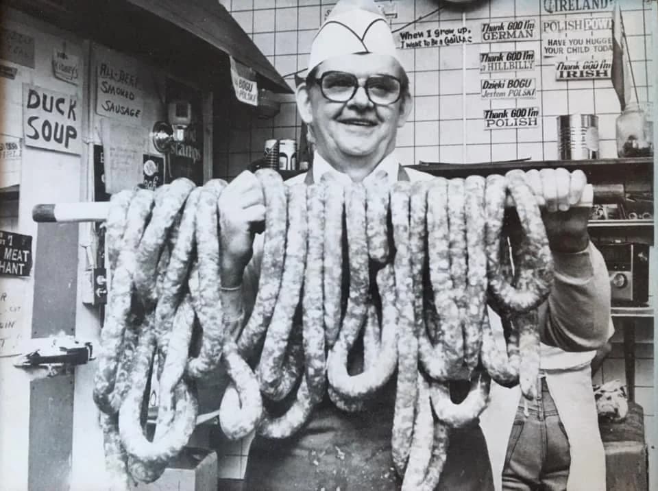 Fred Jaworski, The Kielbasa King, draped in 40 pounds of fresh homemade Polish kielbasa at the original Jaworski Meats in Cleveland Ohio