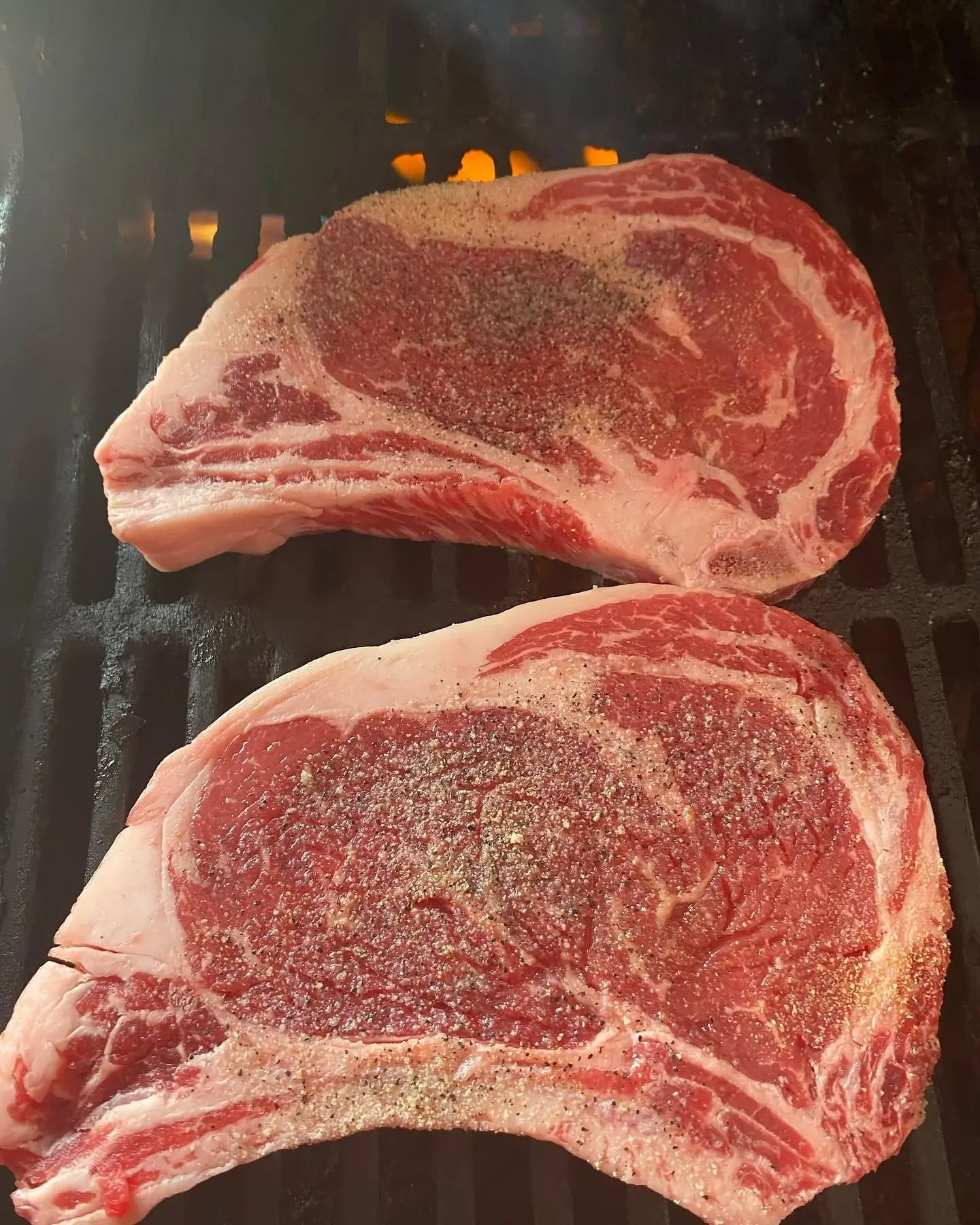Ribeye steaks sizzling on the grill, Browns game day mode at Jaworski Meats